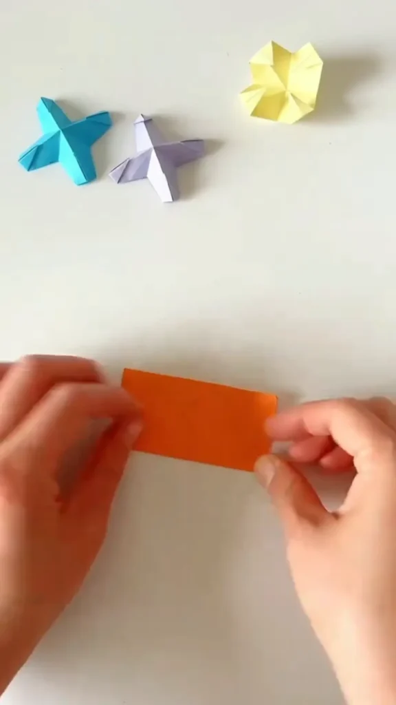 Second diagonal fold on paper creating a perfect X-crease for origami star