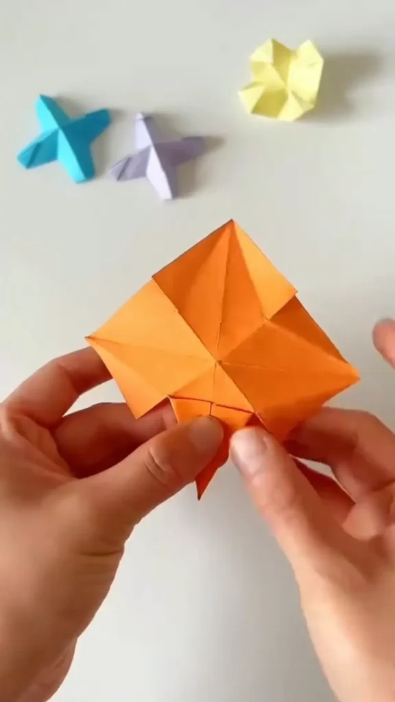 Folding model into diamond shape after collapsing side folds