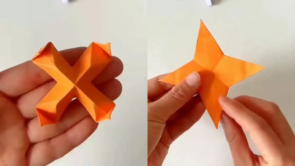 Finished orange origami star made from a single sheet of paper – beginner-friendly paper craft project